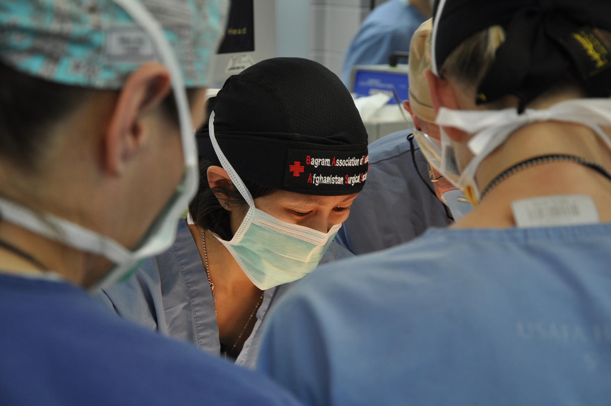 Maj. Kullada Pichakron, a surgeon at the Craig Joint Theater Hospital, checks over the wounds of 12-month-old Afghan boy during a procedure in the operating room. (U.S. Air Force photo by Capt. Erick Saks) 
