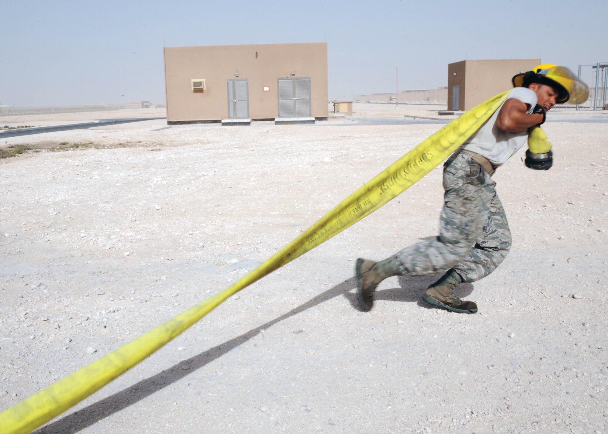 Airman 1st Class Phillip Daugherty receives training in the use of fire truck equipment, Dec. 15. Airman Daugherty is a firefighter with the 379th Expeditionary Civil Engineer Squadron and is deployed from Dover AFB, Del. (U.S. Air Force photo/Senior Airman Katie Gieratz) 