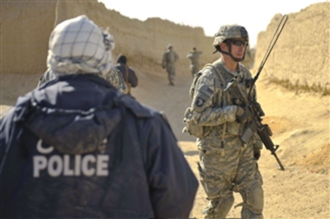 U.S. Army Capt. Justin Quisenberry, the commander of Charlie Company, 3rd Battalion, 187th Infantry Regiment, 101st Airborne Division, conducts a joint patrol with Afghan National Security Forces in Andar district, Ghazni province, Afghanistan, on Jan. 7, 2011.  