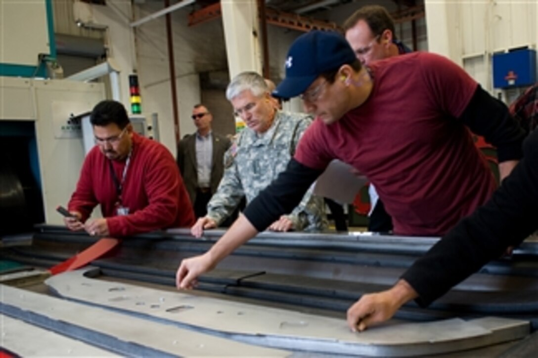 U.S. Army Chief of Staff Gen. George W. Casey Jr. observes how UH-60 Blackhawk helicopter parts are molded during his visit to Corpus Christi Army Depot, Texas, on Jan. 10, 2011.  Casey toured the facilities and thanked employees for their contributions to the U.S. Army.  