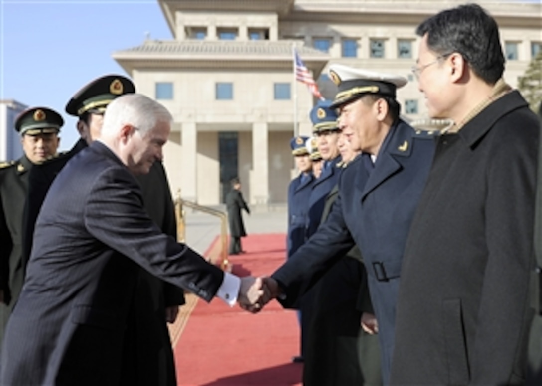 Secretary of Defense Robert M. Gates is greeted by the staff of Chinese Minister of Defense Liang Guanglie as he arrives at the Bayi building in Beijing, China, on Jan. 10, 2011.  