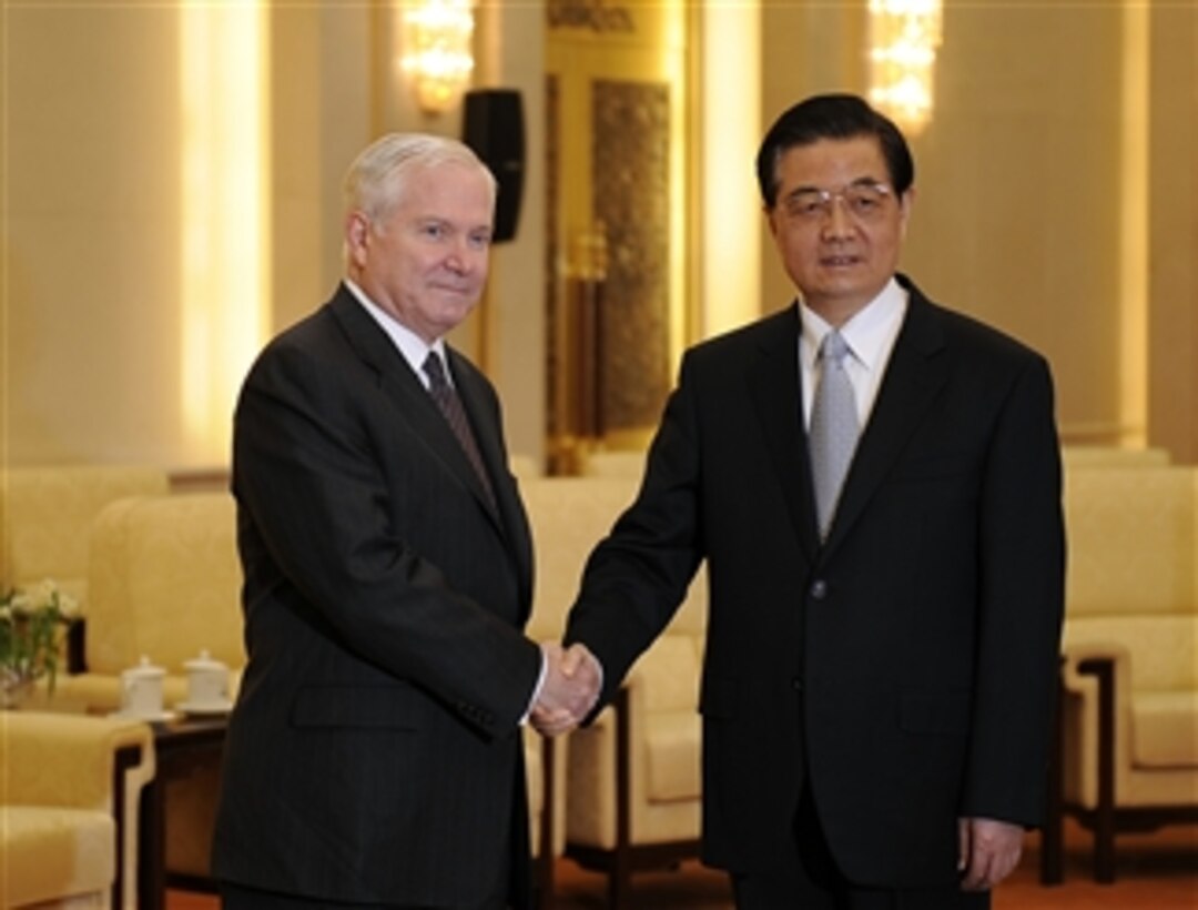 Secretary of Defense Robert M. Gates shakes hands with Chinese President and Chairman of the Central Military Commission Hu Jintao at the Hall of the People in Beijing, China, on Jan. 11, 2011.  
