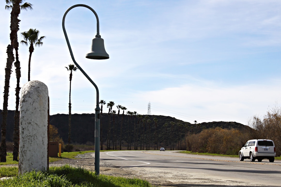 Along Camp Pendleton’s Vandegrift Boulevard stands one of California’s many historic El Camino Real bells that has been around long before any Marine or sailor occupied the land. The bell symbolizes the trail used by the Franciscan Padres on the journey to Northern California from Mexico in the 1800s.  The Padres were Catholic priests sent by the King of Spain to convert Native Americans of California to Catholicism, in order to become citizens of Spain. The bell on base stands where the trail crosses Vandegrift Boulevard, just inland of the main gate.