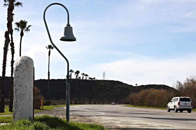 Along Camp Pendleton’s Vandegrift Boulevard stands one of California’s many historic El Camino Real bells that has been around long before any Marine or sailor occupied the land. The bell symbolizes the trail used by the Franciscan Padres on the journey to Northern California from Mexico in the 1800s.  The Padres were Catholic priests sent by the King of Spain to convert Native Americans of California to Catholicism, in order to become citizens of Spain. The bell on base stands where the trail crosses Vandegrift Boulevard, just inland of the main gate.