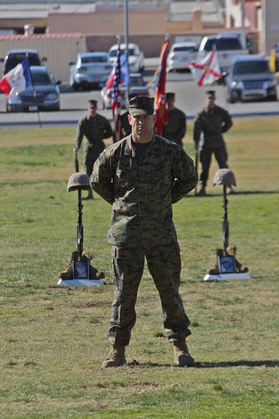 Sergeant Maj. Robert E. Sites Jr., stands before the battlefield crosses in memory of four Marines from 3rd Combat Engineer Battalion who were killed in support of Operation Enduring Freedom during the battalion’s last deployment in 2010. The battalion and families mourned the loss of the four during a memorial ceremony at the Combat Center’s Lance Cpl. Torrey L. Gray Field Jan. 12, 2011.