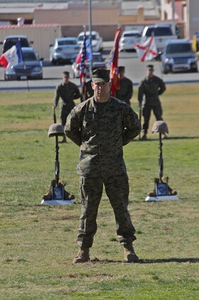 Sergeant Maj. Robert E. Sites Jr., stands before the battlefield crosses in memory of four Marines from 3rd Combat Engineer Battalion who were killed in support of Operation Enduring Freedom during the battalion’s last deployment in 2010. The battalion and families mourned the loss of the four during a memorial ceremony at the Combat Center’s Lance Cpl. Torrey L. Gray Field Jan. 12, 2011.