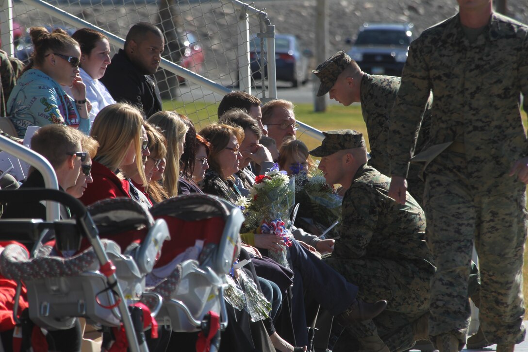 Marines with 3rd Combat Engineer Battalion present flowers and words of encouragement to family members of four Marines lost in support of Operation Enduring Freedom during the unit’s memorial service Jan. 12, 2011. The ceremony was held at the Combat Center’s Lance Cpl. Torrey L. Gray Field.