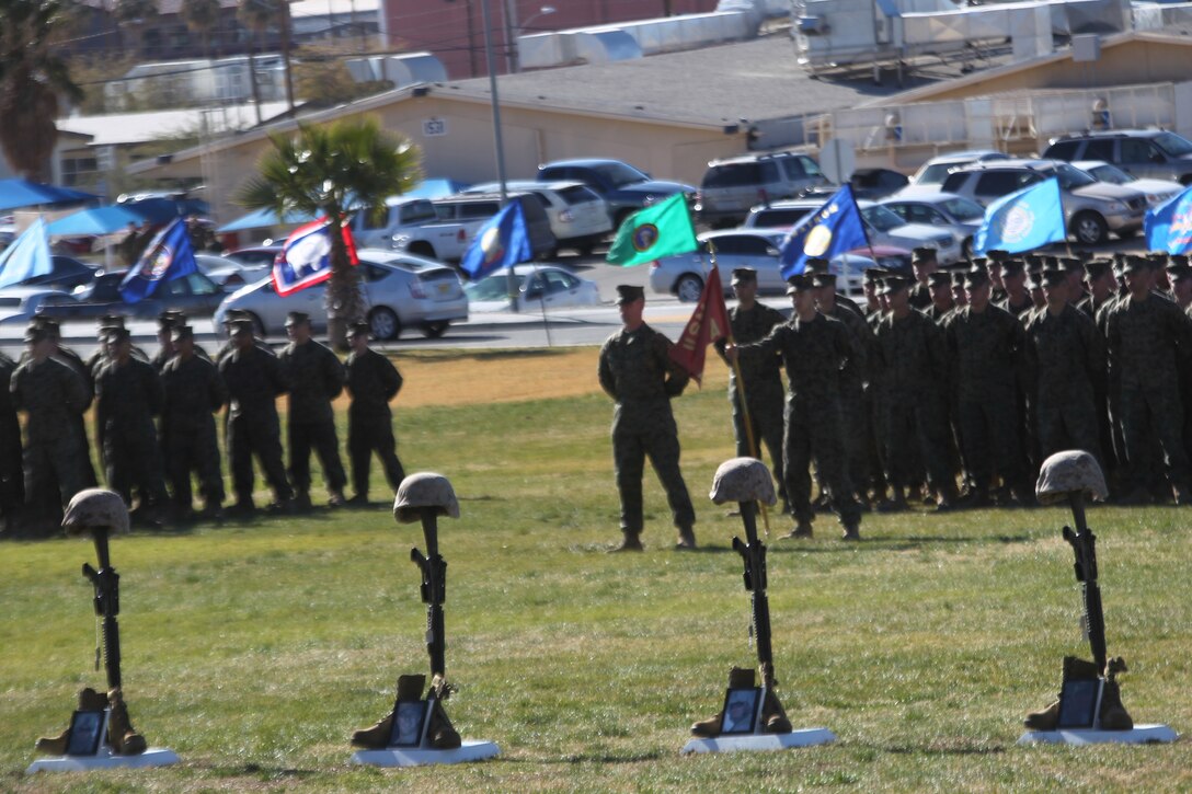 Four battlefield crosses commemorating Marines lost in action in support of Operation Enduring Freedom in 2010 from 3rd Combat Engineer Battalion, stand on display Jan. 12,  2011, at the Combat Center’s Lance Cpl. Torrey L. Gray Field. The families of the four Marines were also in attendance at the service.