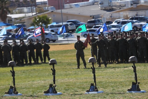 Four battlefield crosses commemorating Marines lost in action in support of Operation Enduring Freedom in 2010 from 3rd Combat Engineer Battalion, stand on display Jan. 12,  2011, at the Combat Center’s Lance Cpl. Torrey L. Gray Field. The families of the four Marines were also in attendance at the service.