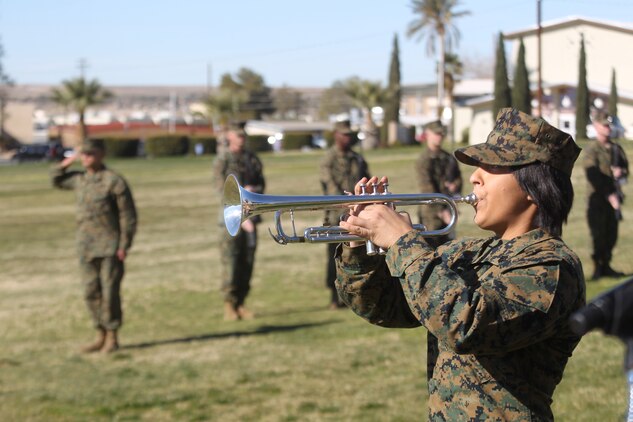 Corporal Cynthia Rivera, a bugler with the Combat Center’s Marine Corps Band, sounds Taps at the end of 3rd Combat Engineer Battalion’s memorial service Jan. 12, 2011, at the Combat Center’s Lance Cpl. Torrey L. Gray Field. The memorial service was held in honor of four Marines who gave their lives in support of Operation Enduring Freedom in 2010.