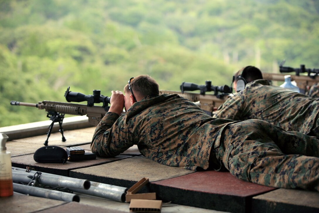 Marines from 3rd Reconnaissance Battalion, 3rd Marine Division, III Marine Expeditionary Force, train with the Model 110 Semi-automatic Sniper System during familiarization training Jan. 12.