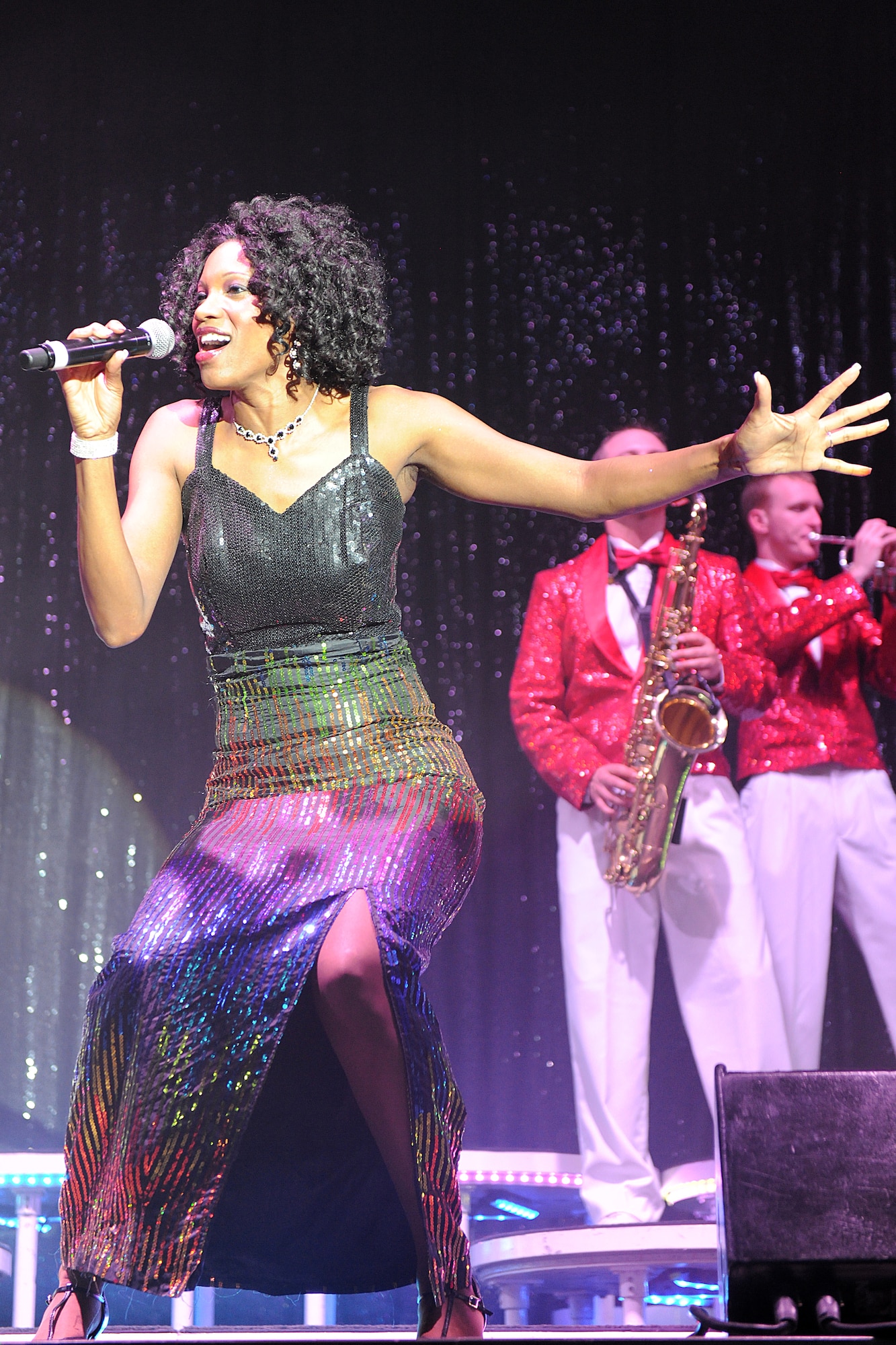 KUNSAN AIR BASE, Republic of Korea --Staff Sgt. Candace Fagan sings to the crowd during a Tops in Blue performance Jan. 11. The Tops in Blue group performed their 2010 "We Believe" World Tour for the base Jan. 11-12. The performance included renditions of songs from artists including Michael Buble, Lady Gaga, and the Black Eyed Peas. (U.S. Air Force photo/Staff Sgt. Jonathan Pomeroy) 