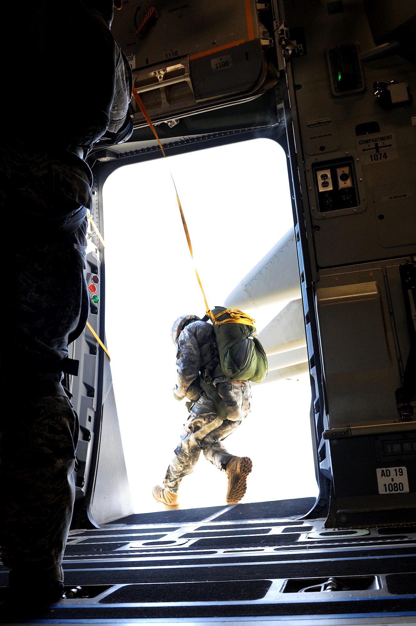 Members of the 36th Contingency Response Group conduct static line jump training from a Hickam C-17 over Andersen Air Base, Guam, Jan. 11. Aircrews from the 535th Airlift Squadron dropped nine training pallets during a single day of training before prviding airlift for the 36th CRG jumpers. (U.S. Air Force photo/Staff Sgt. Mike Meares)