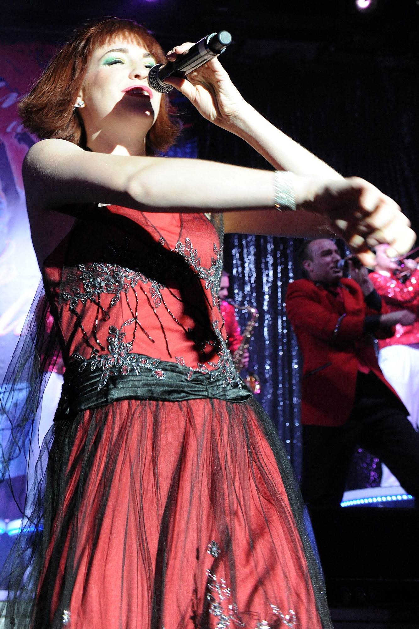 KUNSAN AIR BASE, Republic of Korea --Airman 1st Class Jette Warnick sings to the crowd during a Tops in Blue performance Jan. 11.  The Tops in Blue group performed their 2010 "We Believe" World Tour for the base Jan. 11-12. The performance included renditions of songs from artists including Michael Buble, Lady Gaga, and the Black Eyed Peas. (U.S. Air Force photo/Staff Sgt. Jonathan Pomeroy)
