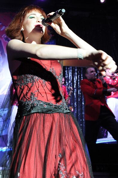 KUNSAN AIR BASE, Republic of Korea --Airman 1st Class Jette Warnick sings to the crowd during a Tops in Blue performance Jan. 11.  The Tops in Blue group performed their 2010 "We Believe" World Tour for the base Jan. 11-12. The performance included renditions of songs from artists including Michael Buble, Lady Gaga, and the Black Eyed Peas. (U.S. Air Force photo/Staff Sgt. Jonathan Pomeroy)
