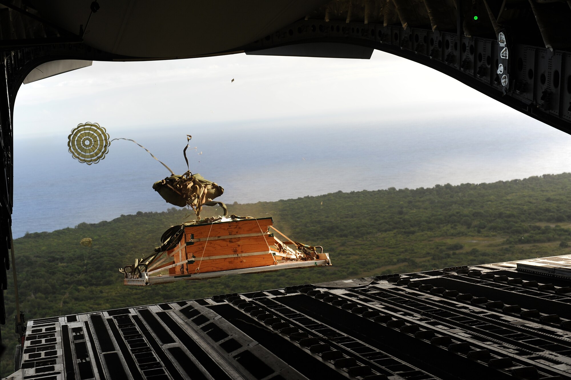 Aircrews from the 535th AS dropped nine training pallets during a single day Jan. 11, 2011 while on temporary assignment to Andersen Air Base, Guam. The aircrew then helped the 36th Contingency Response Group with static line jump training. (U.S. Air Force photo/Staff Sgt. Mike Meares)