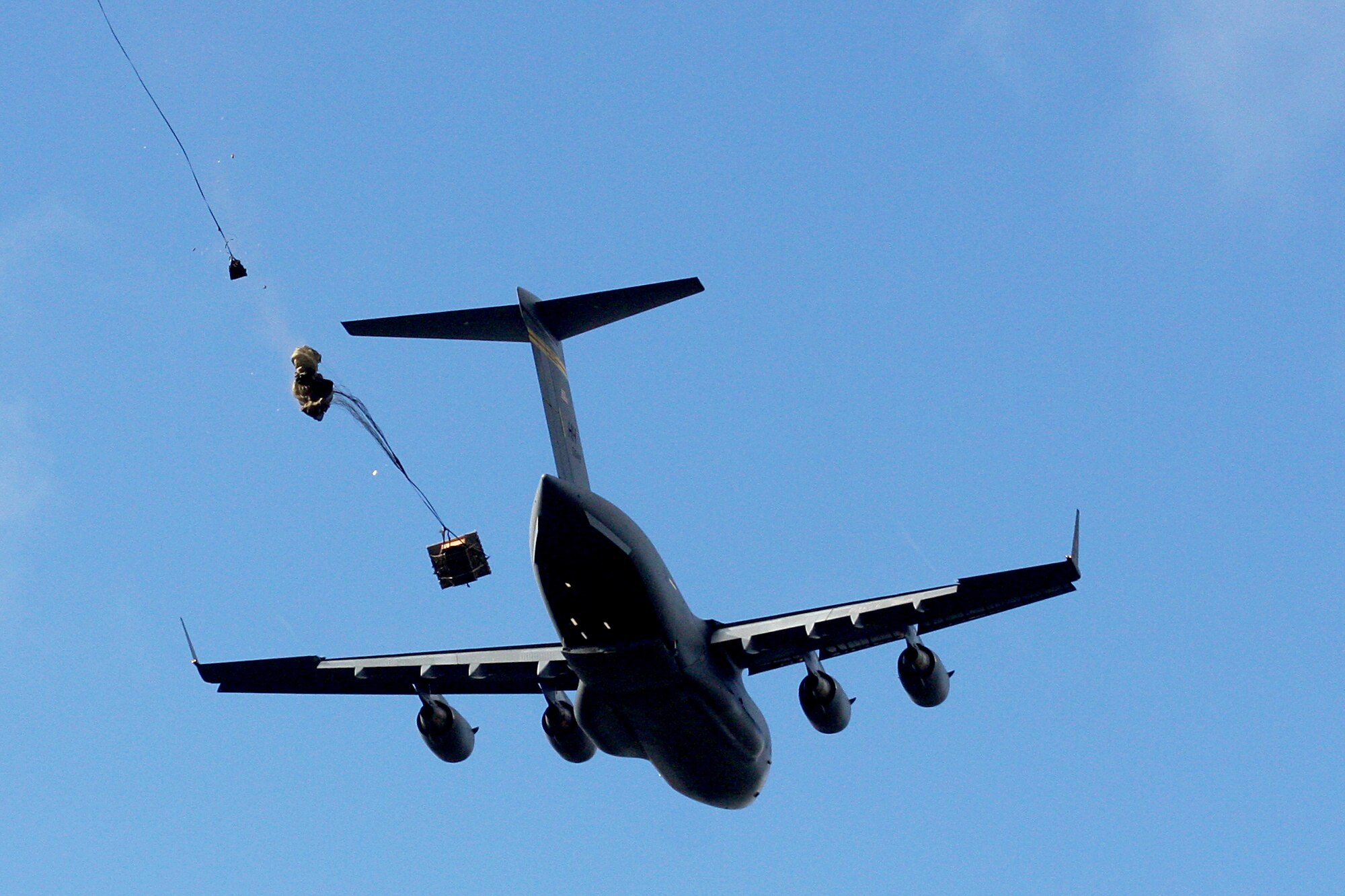 Aircrews from the 535th Airlift Squadron dropped a total of nine training pallets during a single day of airdrop training while on a temporary assignment to Andersen Air Base Guam. The aircrew then helped the 36th Contingency Response Group with static line jump training. (U.S. Air Force photo/Capt. Dave Monaco)