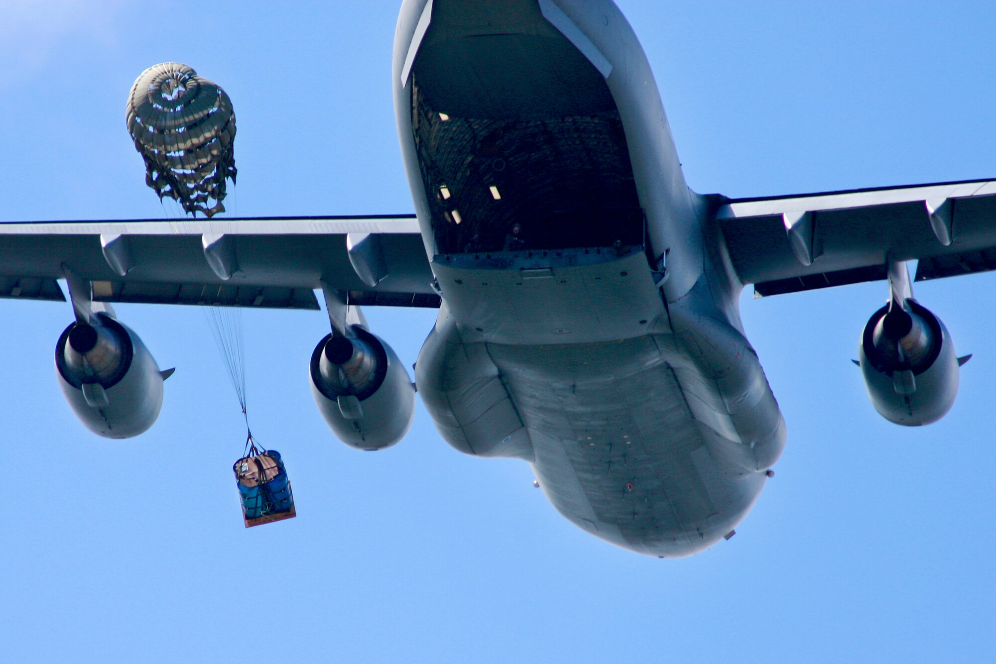 Aircrews from the 535th AS dropped nine training pallets during a single day of training while on a temporary assignment to Andersen Air Base Guam. The aircrew then helped the 36th Contingency Response Group with static line jump training. (U.S. Air Force photo/Capt. Dave Monaco)