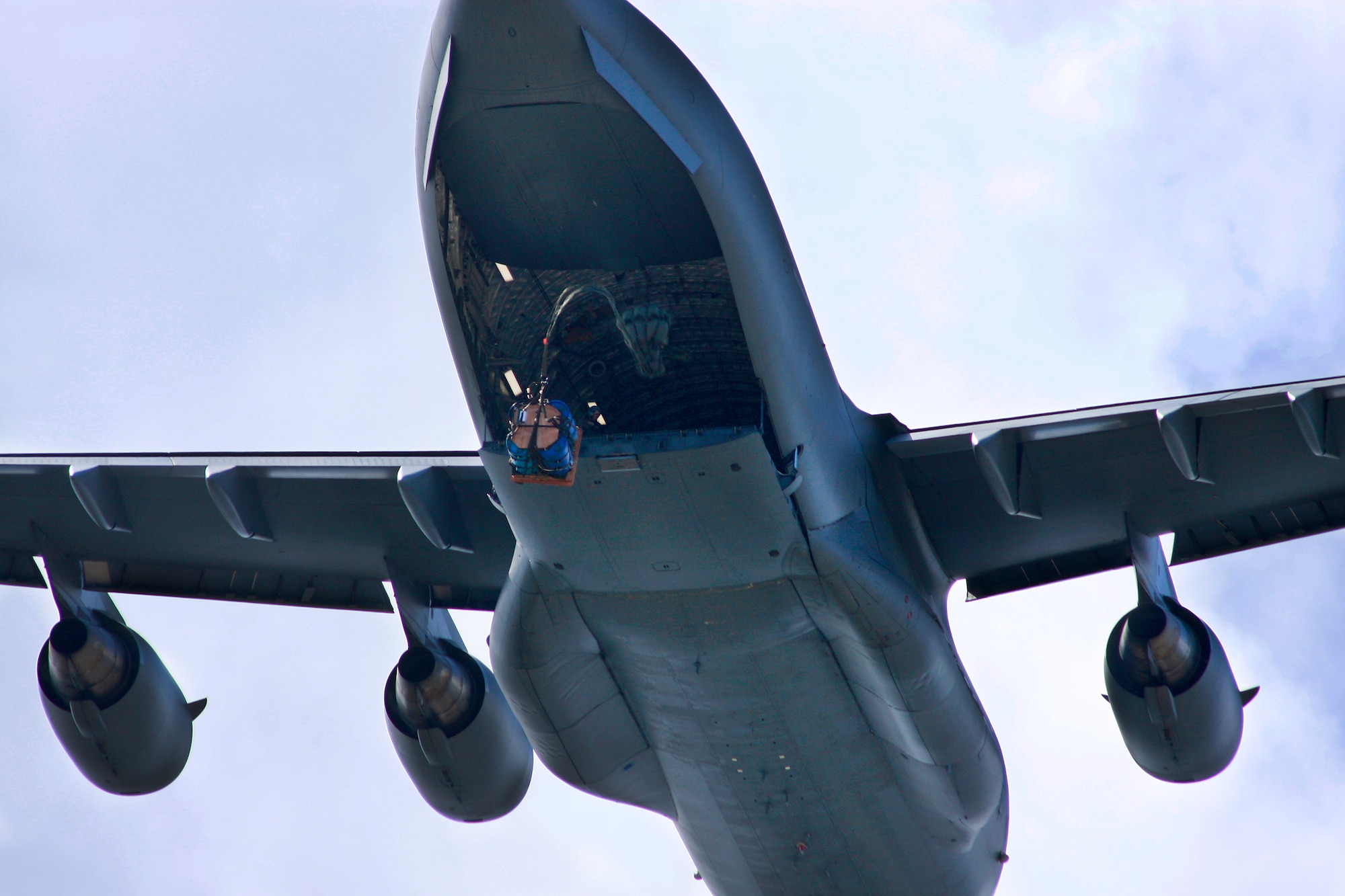 Aircrews from the 535th AS dropped nine training pallets during a single day of training while on a temporary assignment to Andersen Air Base Guam. The aircrew then helped the 36th Contingency Response Group with static line jump training. (U.S. Air Force photo/Capt. Dave Monaco)