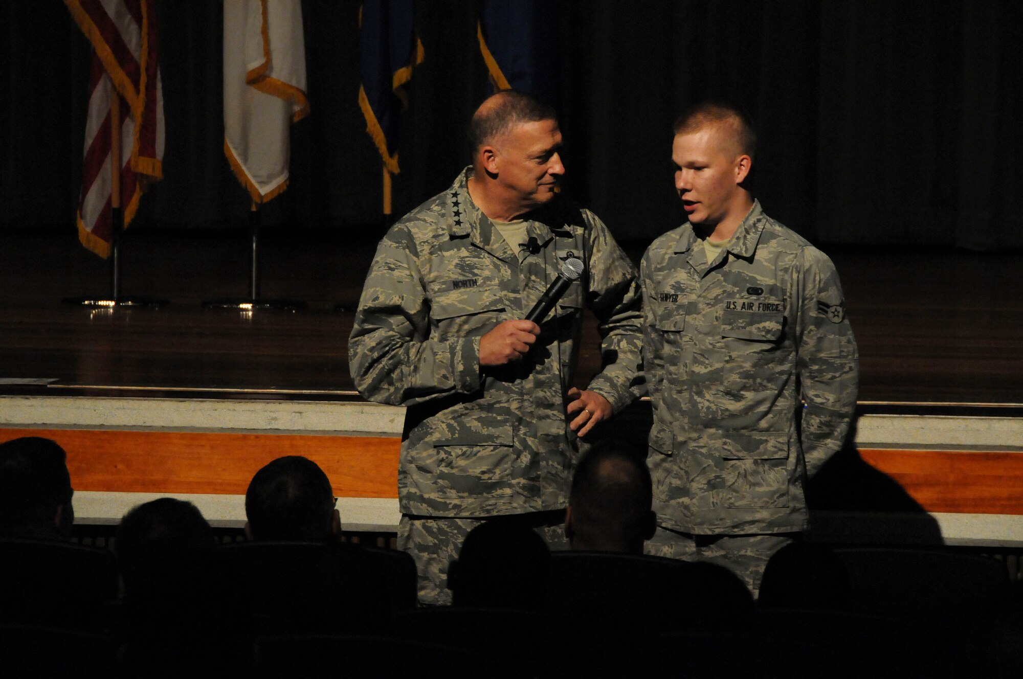 Gen. Gary North, Pacific Air Forces commander, discusses  "don't ask,
don't tell" with Airman 1st Class Christopher Sawyer, 18th Logistics
Readiness Squadron fuels apprentice, during his visit of Kadena Air Base
Jan. 11. Airmen from the 18th Wing had the  chance to get ask various
questions and get their answers directly from the PACAF commander during his
Airmen's call. (U.S. Air Force photo/Staff Sgt. Darnell T. Cannady)
