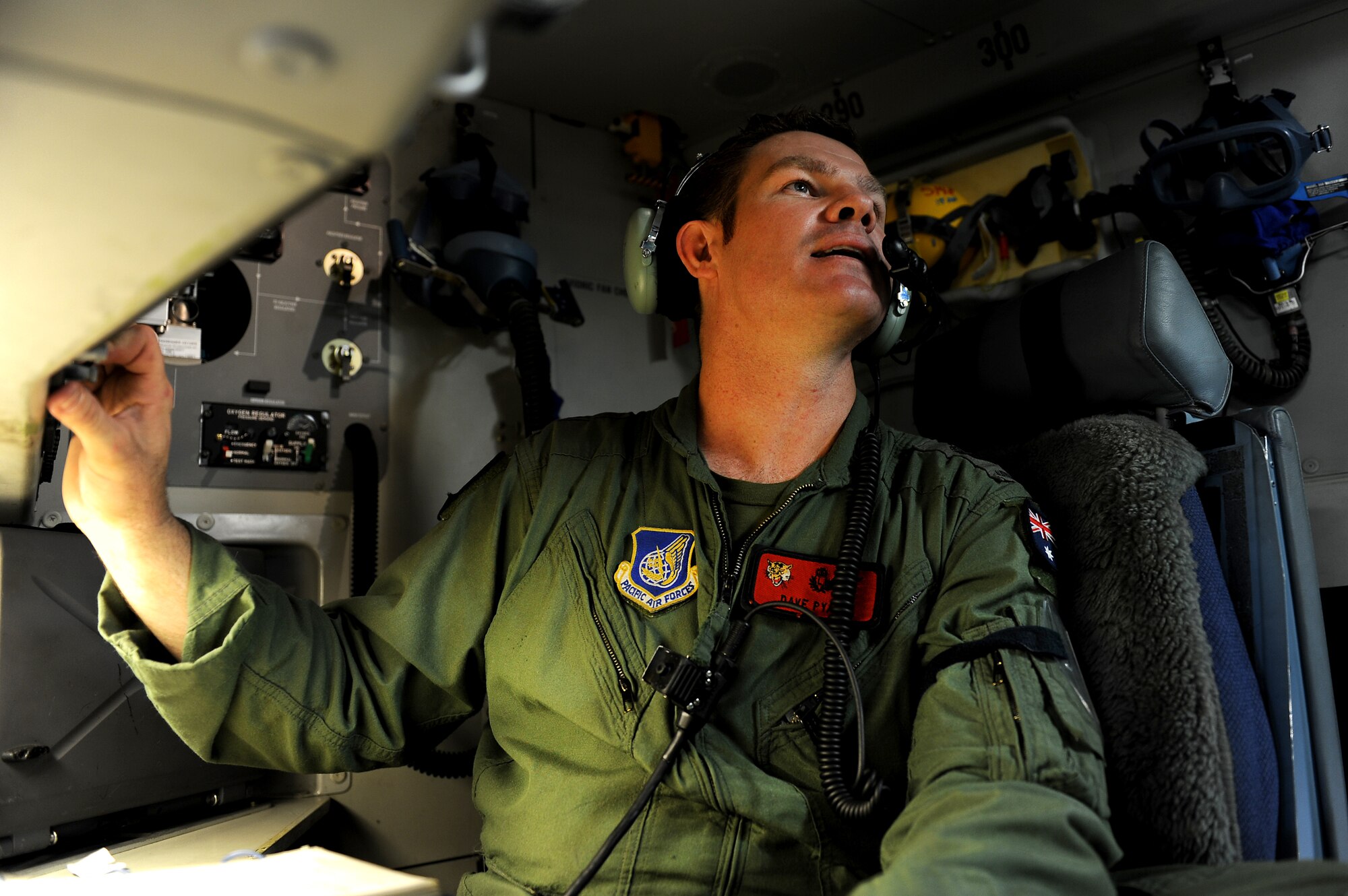 Royal Australian Air Force Flight Sgt. Dave Pyatt, 535th Airlift Squadron loadmaster, breif space available passengers prior to take off Jan. 11. Aircrews from the 535th AS dropped nine training pallets during a single day of training over Andersen Air Base, Guam. The aircrew then helped the 36th Contingency Response Group with static line jump training as well. Flight Sergeant Pyatt has been assigneed to the 535th AS as part of an exchange program with the U.S. Air Force for the past three years. (U.S. Air Force photo/Staff Sgt. Mike Meares)