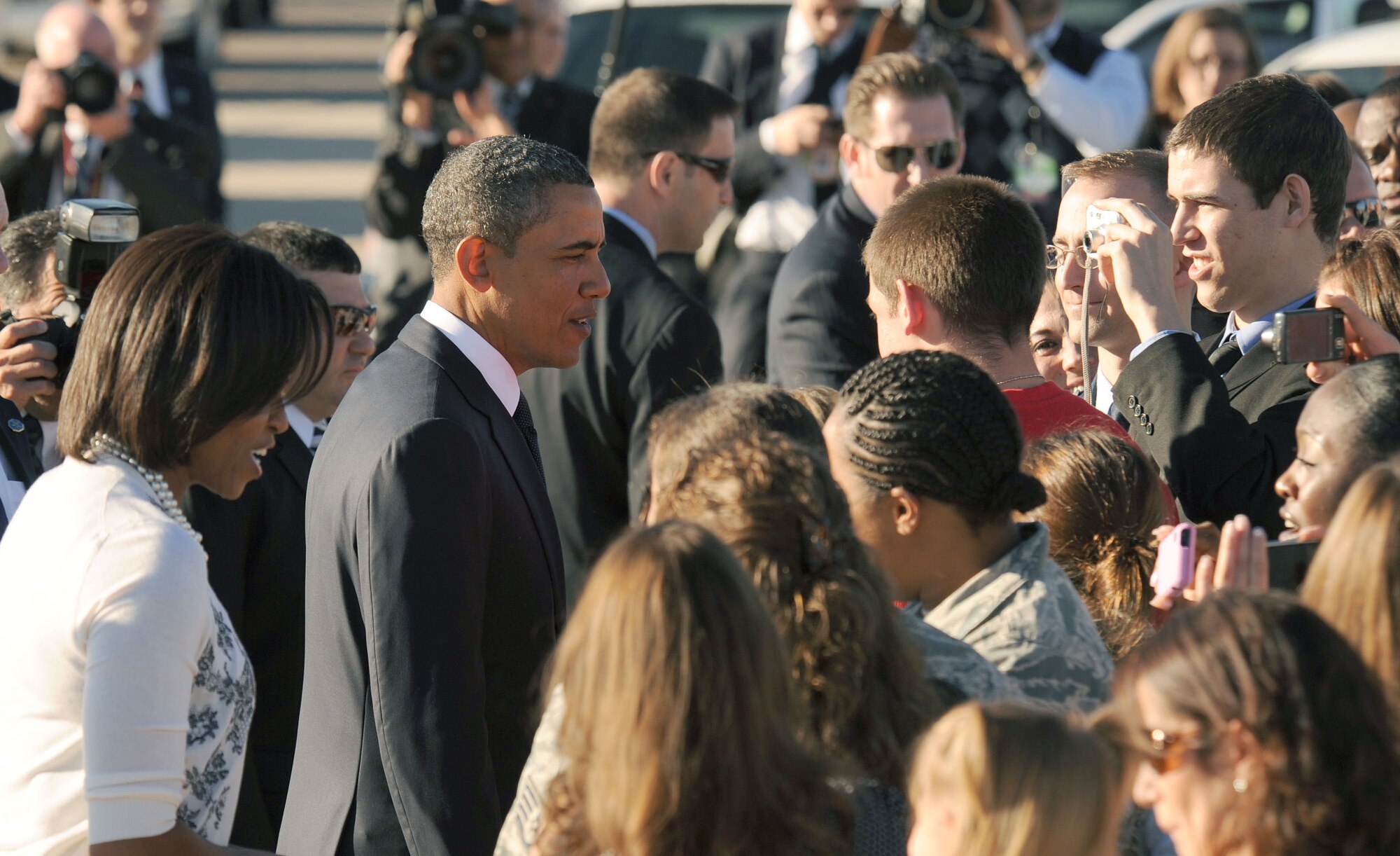 DAVIS-MONTHAN AIR FORCE BASE, Ariz. - President Barack Obama and First Lady Michelle Obama greet members of the D-M community after landing here Jan. 12. The President and the First Lady arrived at D-M before traveling to attend the memorial service commemorating the six lives lost Jan. 8 in Tucson, Ariz. (U.S. Air Force photo/ Senior Airman Brittany Dowdle)
