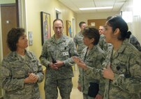 Col. Margaret Matarese, left, the Air Education Training Command command surgeon and Col. Douglas Curry, second from left, 71st Medical Group commander, and Chief Master Sgt. Marie Potts, AETC chief of the medical enlisted force, listen to an Airman as they tour the 71st Medical Group clinic Tuesday, Jan. 11, 2011. As the AETC surgeon, Col. Matarese oversees medical operations for AETC's 13 medical units. (U.S Air Force photo/Airman 1st Class Shakon Smith)
