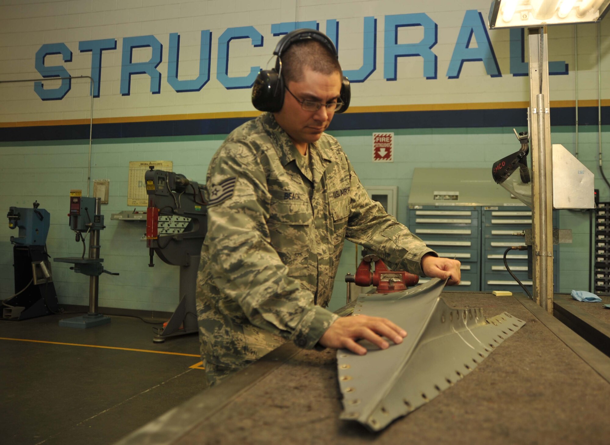 Tech. Sgt. Michael H. Beach, 22nd Maintenance Squadron section production supervisor, inspects the dovetail of a KC-135 Stratotanker, Jan. 10, 2011, McConnell Air Force Base, Kan.  As a section production supervisor, Sergeant Beach is responsible for repairing and monitoring all 63 KC-135s assigned here.  (U.S. Air Force photo/Senior Airman Abigail Klein)
