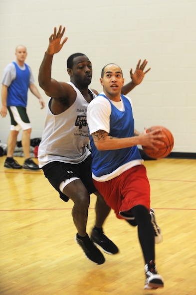 MINOT AIR FORCE BASE N.D. -- Airman 1st Class Cody Smith, 5th Mission Support Group, runs to the hoop for a layup during a basket ball game at the McAdoo Fitness Center here Jan. 10. The 91st Operations Group defeated the 5th Mission Support Group 85 to 68.  (U.S. Air Force photo/Airman 1st Class Aaron-Forrest Wainwright)
