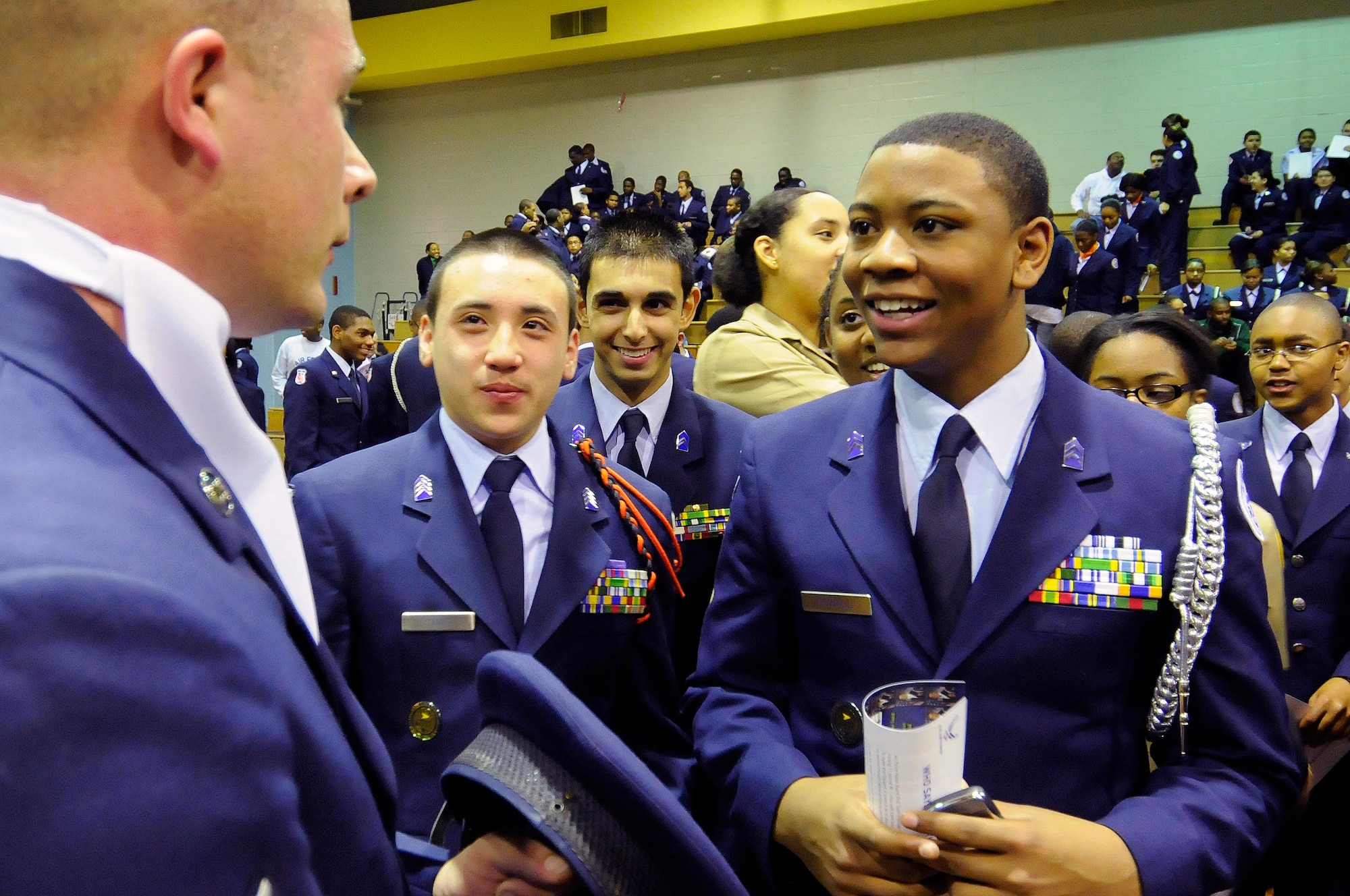 BRANDYWINE, Md. – Members of the U.S. Air Force Honor Guard Drill Team meet with Junior ROTC cadets following a performance by the Jan. 8 at Gwynn Park High School. Junior ROTC cadets and high school-level drill teams took a break from a competition to view inspiring movements and precision by the Air Force’s premier drill team. Those in attendance also took photos with the Airmen and received autographs following the event. (U.S. Air Force photo by Senior Airman Steele C. G. Britton) 