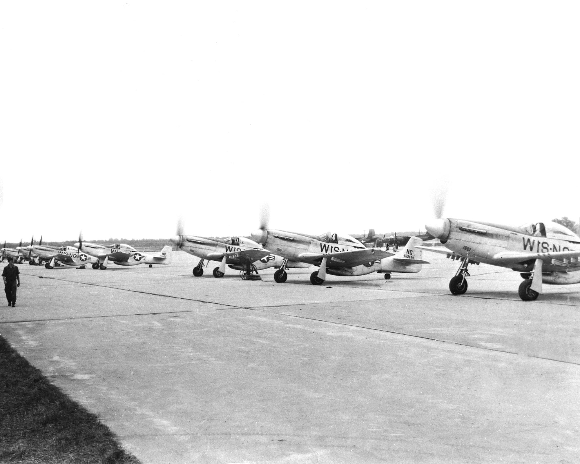 P-51D "Mustangs" warm up on the flight line. The Mustang was flown from 1947-1949 and from 1952-1953.