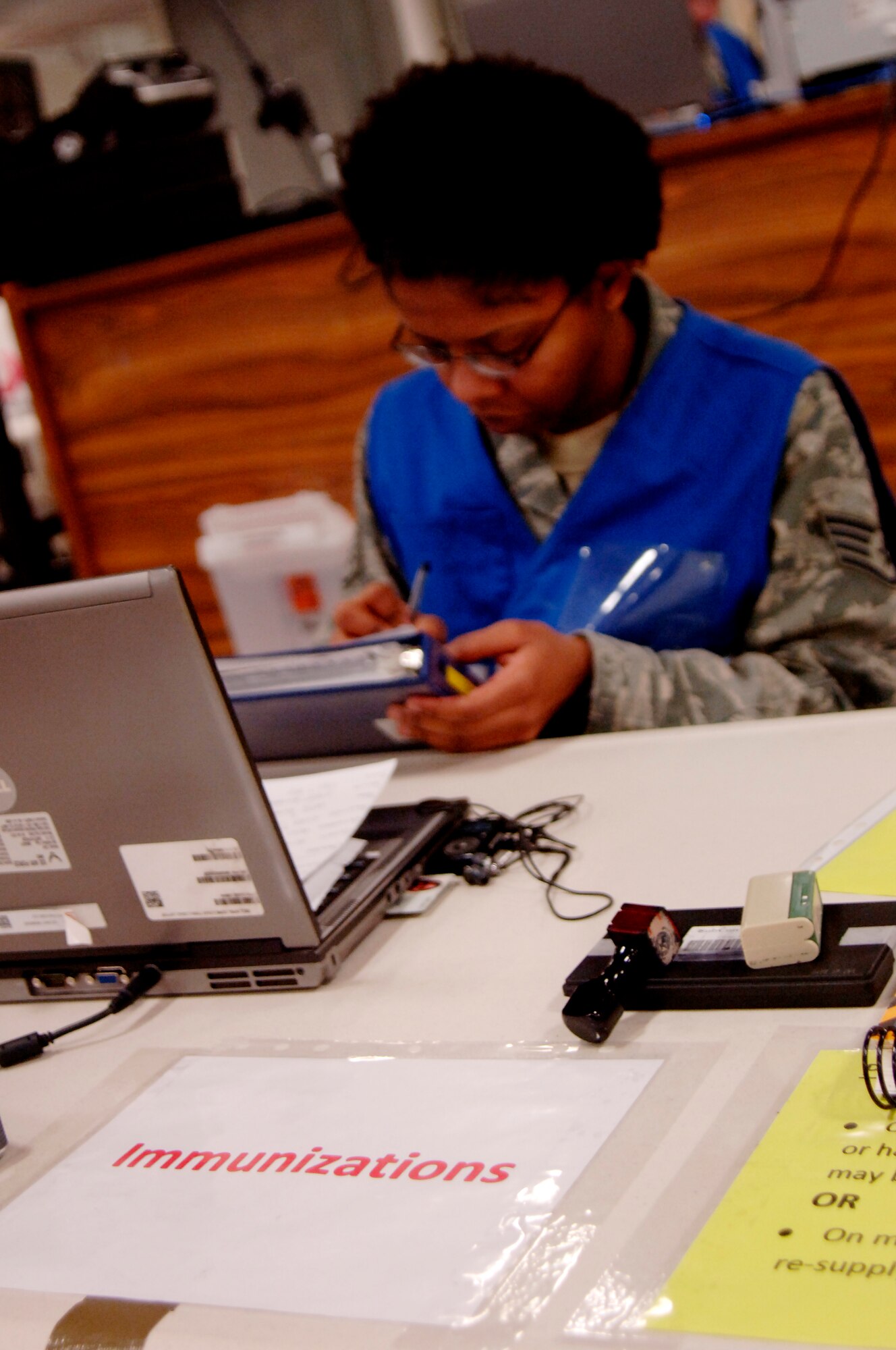 Staff Sgt. Chrishana Dameron, 375th Medical Group NCO in charge of allergy and immunizations, looks through the immunization records of Airmen scheduled to process through the mobility line during the mobility exercise, Jan. 12, 2011 at Scott Air Force Base, Ill. The preparation by Sergeant Dameron will help move more than 200 Airmen through the line as quickly as possible. (U.S. Air Force photo/ Senior Airman Wesley Farnsworth)