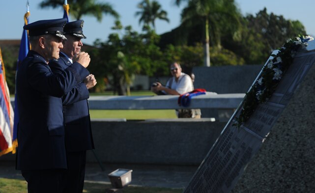 Maj. Gen.  Eric W. Crabtree, 4th Air Force Commander, March Air Reserve Base, Calif. and Col. Robert A. "Randy" Huston render a salute during a remembrance ceremony at Atterbury Circle, Joint Base Pearl Harbor-Hickam Dec. 7, 2010. This year marks the 69th anniversary of the Dec. 7, 1941 attacks on Oahu by the Japanese Empire, which in turn, launched the United States into World War II. (U.S. Air Force Photo/Airman 1st Class Lauren Main)