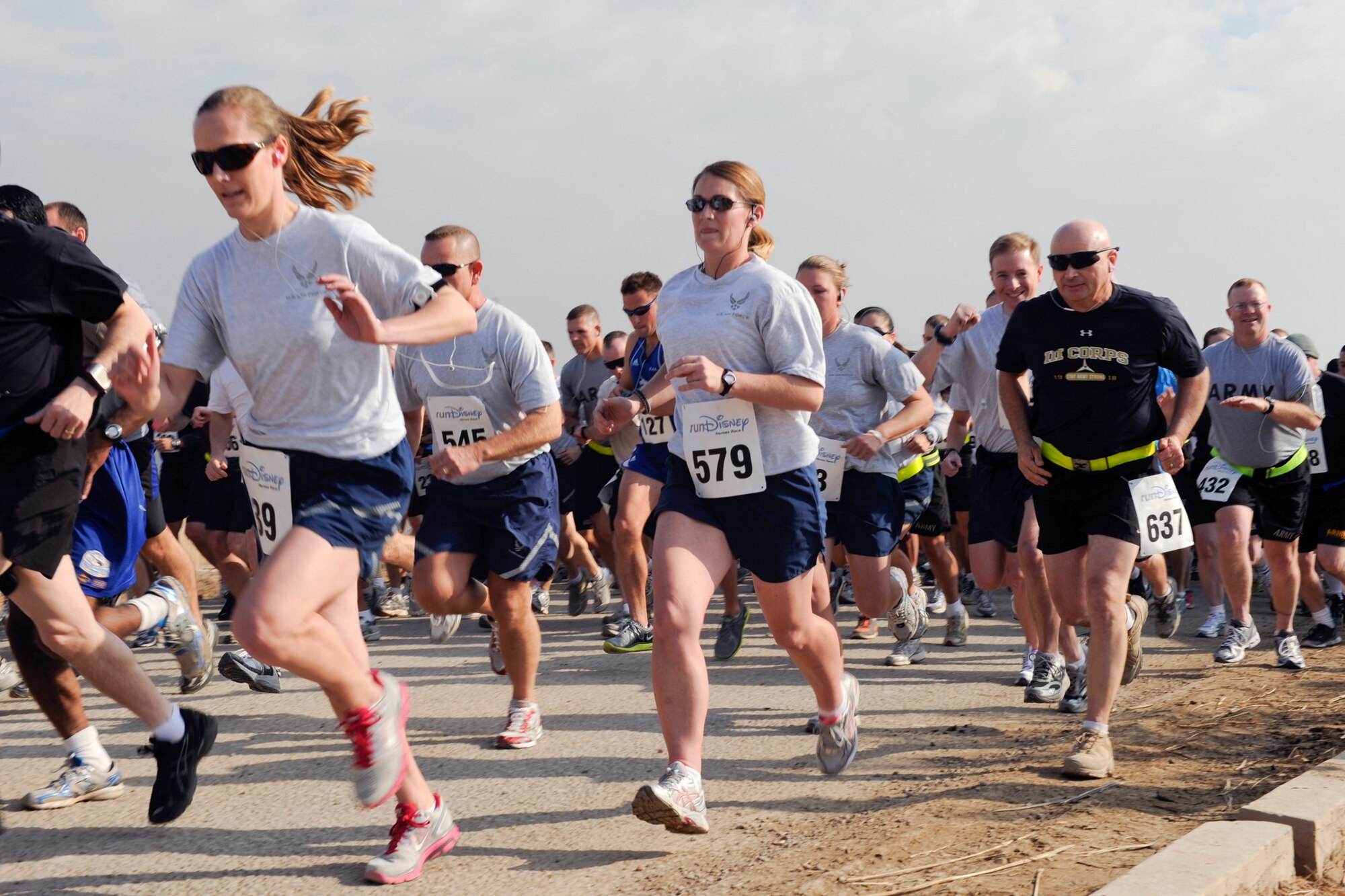 Members from all branches of the U.S. military and from several different countries' militaries participate in the Disney Heroes Race Jan. 8, 2011, in Baghdad. The 13.1 mile race mirrored the Disney Half Marathon and also included a live video stream to the stateside event. (U.S. Air Force photo/Staff Sgt. Levi Riendeau)
