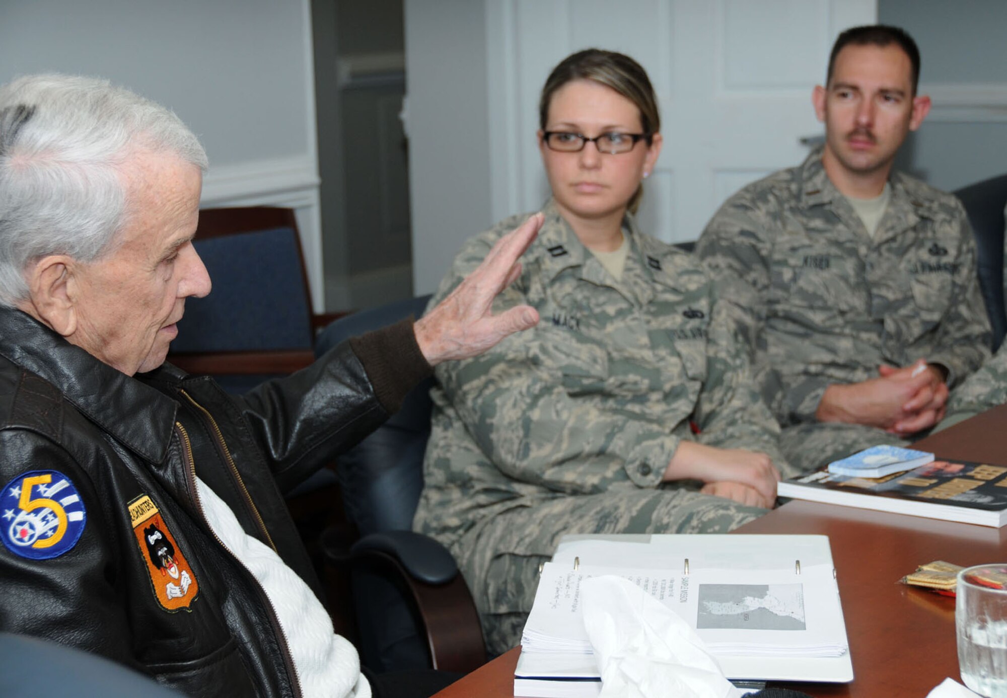 Retired Maj. Gen. Jesse Allen of Biloxi, left, discusses his autobiography, “From Jeep
Driver to General,” with Capt. Jennifer Mack, 81st Training Group, and 2nd Lt. Bill
Kiser, 81st Comptroller Squadron, during a company grade officers council book club
meeting Jan. 5 at 81st Training Wing headquarters.  (U.S. Air Force photo by Kemberly Groue)