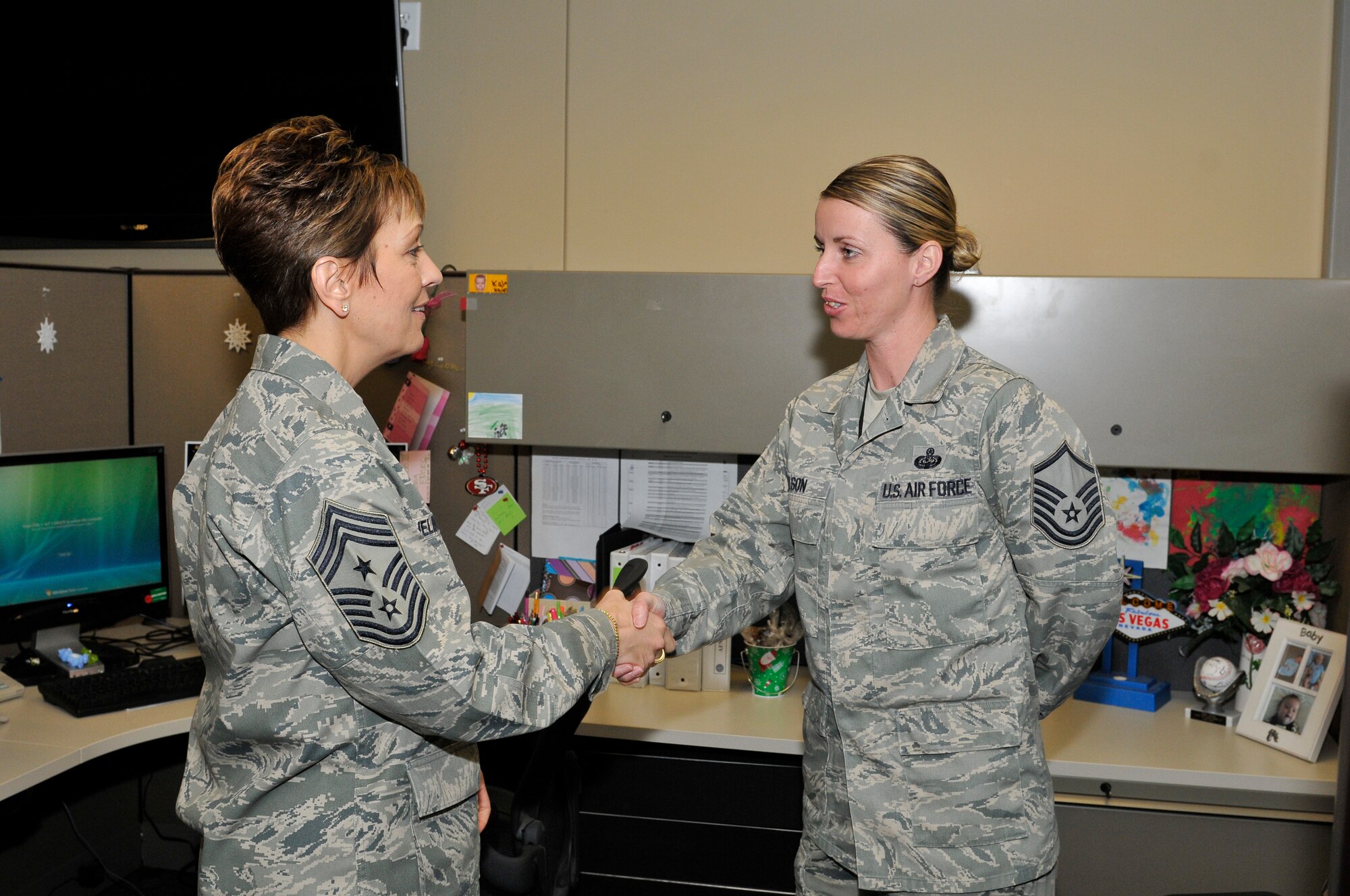 Chief Master Sgt. Denise Jelinski-Hall (left), National Guard Bureau Senior Enlisted Leader, greets Master Sgt. Terry Olson of Air Forces Northern Communications and Information Directorate during the chief’s visit to AFNORTH Jan. 5, 2011. (U.S. Air Force Photo by Lisa Norman)