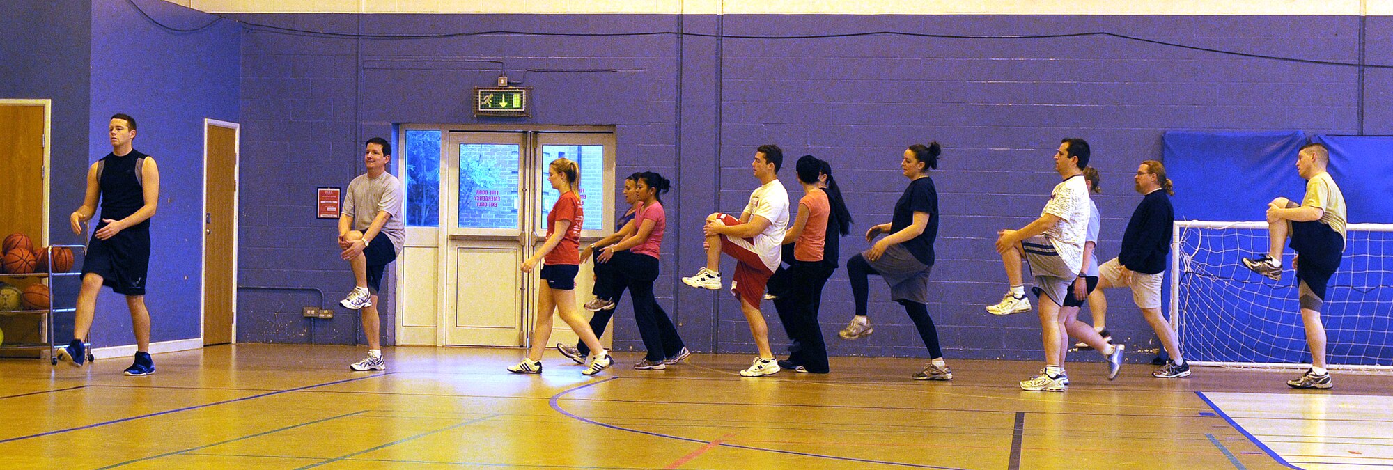 RAF MILDENHALL, England -- Base members warm up before a High-Intensity Interval Training class at the North Side Fitness Center here Jan. 12, 2011.  The class is offered Monday, Wednesday and Friday at 11 a.m. (U.S. Air Force photo/Senior Airman Tabitha M. Lee)