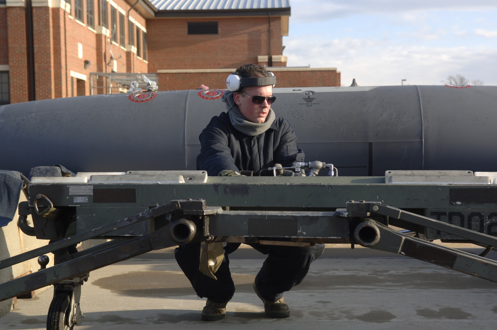 LANGLEY AIR FORCE BASE, Va - Airman 1st Class Daniel Workman, 1st Maintenance Squadron weapons loader, inspects munitions before loading them onto an aircraft during  an Operational Readiness Exercise Jan. 8. The 1st Fighter Wing, 633d Air Base Wing and 192d Fighter Wing tested the Wings’ readiness if faced with a disaster, imminent terrorist or enemy threat or short-notice orders to deploy.  (U.S. Air Force photo/Staff Sgt. Ashley Hawkins)(RELEASED)