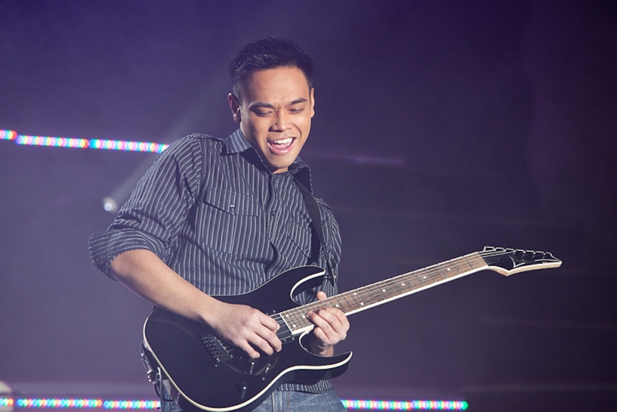 LACKLAND AFB, TEXAS -- Airman 1st Class Jonathan Salvador, 17th Munitions Squadron air launched cruise missile maintenance team member performs an electric guitar solo at the Bob Hope Performing Arts Center, during the Air Force Worldwide Talent Search Dec. 10, 2010. Airman Salvador was named best in show and top musician for the competition. (Courtesy Photo)