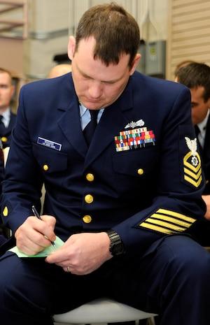 Coast Guard Machinery Technician Chief Donald Wiggins writess down his short and long term financial goals during an interactive financial goal setting training held Jan. 10 onboard Joint Base Charelston-Weapons Station. MKC Wiggins is attached to the U.S. Coast Guard Station Charleston. (U.S. Navy photo/Mass Communication Specialist 1st Class Jennifer Hudson
