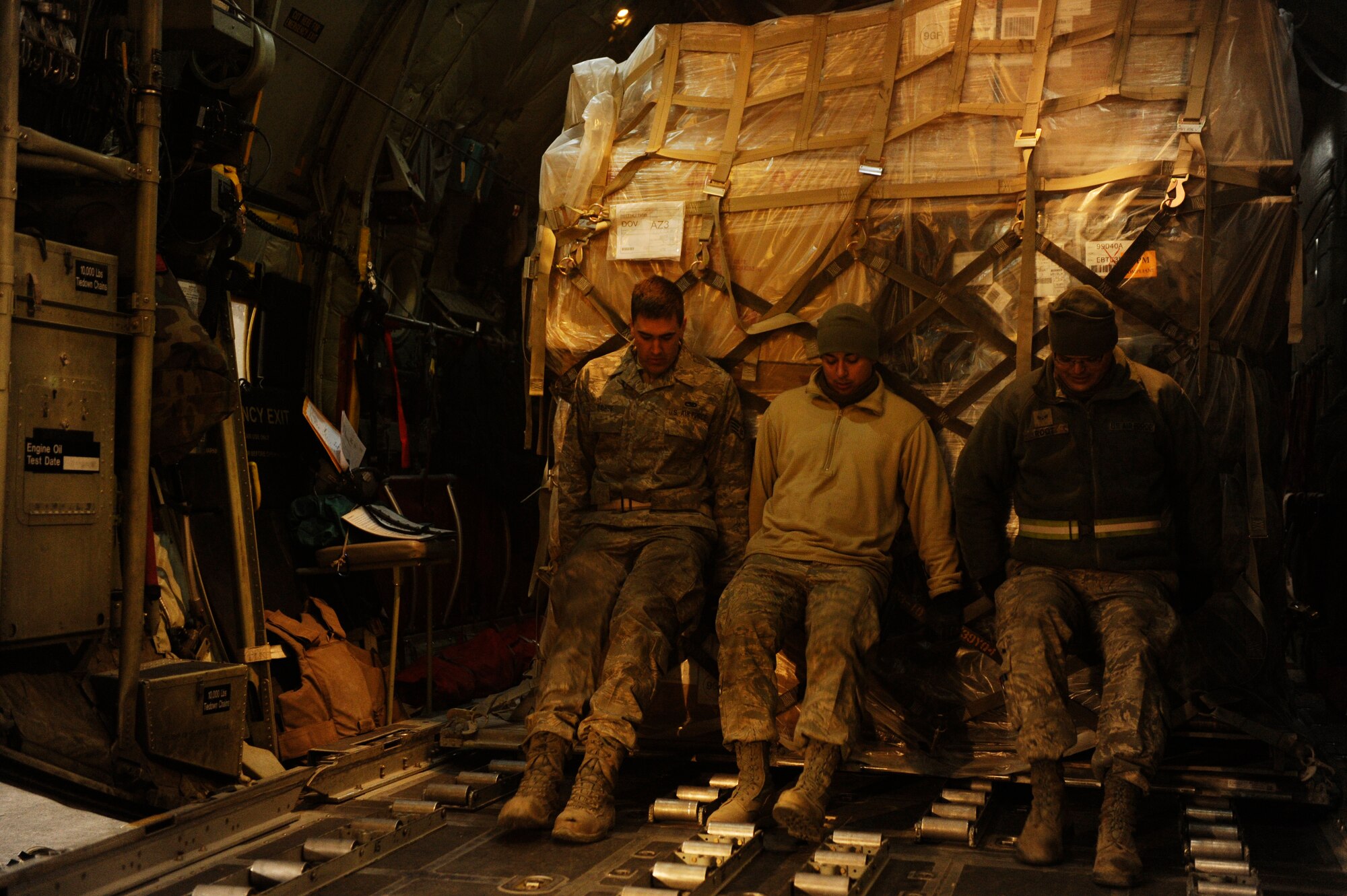 U.S. Air Force Airmen from the 455th Expeditionary Aerial Port Squadron load a pallet aboard a C-130H Hercules at Bagram Airfield, Afghanistan before a mission to deliver supplies to forward operating bases in support of Operation Enduring Freedom, Jan 2, 2011.  C-130 aircrews deliver supplies by air to reduce the number of ground convoys that are at risk.  (U.S. Air Force Photo/Staff Sgt. Eric Harris) (RELEASED)