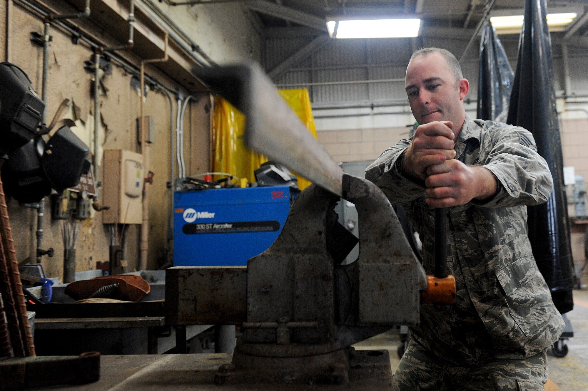 Staff Sgt. Jason Vick, a member of the18th Civil Engineer Squadron’s Operations Flight, clamps down a piece of angle iron for welding, Jan 10. The Operations Flight was recently awarded the 2010 Major General Clifton D. Wright Award, which recognizes the most outstanding CE Operations Flight in the performance of quality maintenance, repair, and improvement of installation facilities and infrastructure. (U.S. Air Force photo/Staff Sgt. Jonathan Steffen)