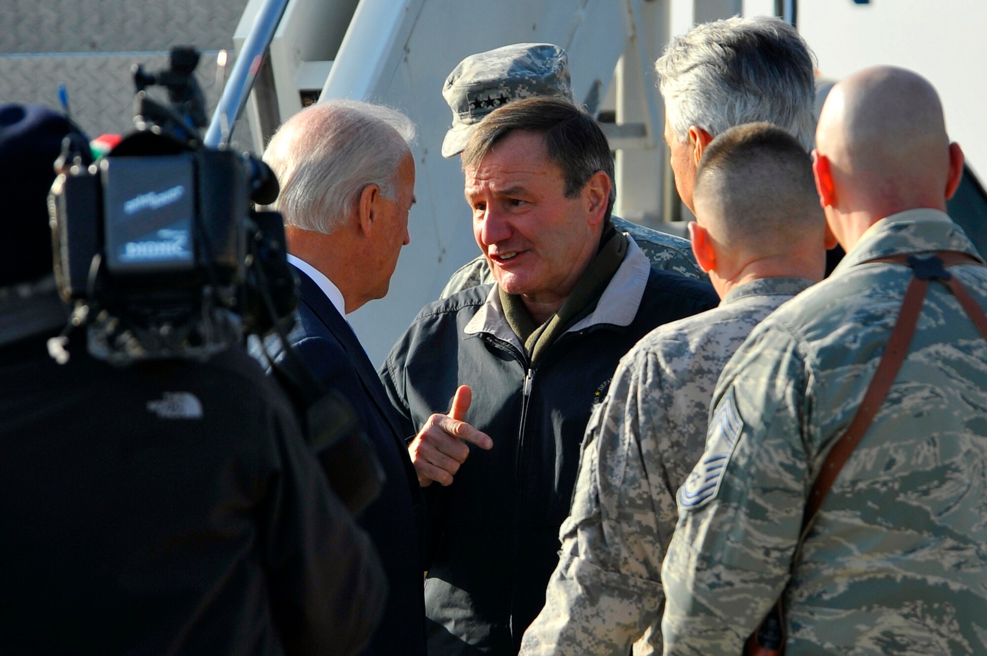 U.S. Ambassador to Afghanistan Karl Eikenberry talks to Vice President Joe Biden during his short visit here at Bagram Airfield, Afghanistan, Jan. 12, 2011. Vice President Biden arrived in Afghanistan on an unannounced visit to assess progress toward the transition to Afghan-led security and to demonstrate the United States' commitment to a long-term partnership with Afghanistan. (Air Force photo/Senior Airman Sheila deVera)