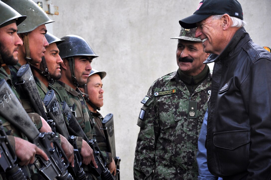 Afghan army Brig. Gen. Amlaqullah Patyani, commander of the Kabul Military Training Center, introduces U.S. Vice President Joe Biden to Afghan recruits during a break in training on military operations in urban terrain in Kabul, Afghanistan, Jan. 11, 2011. At any given time, more than 10,000 recruits at the center are preparing to serve in the Afghan army.  