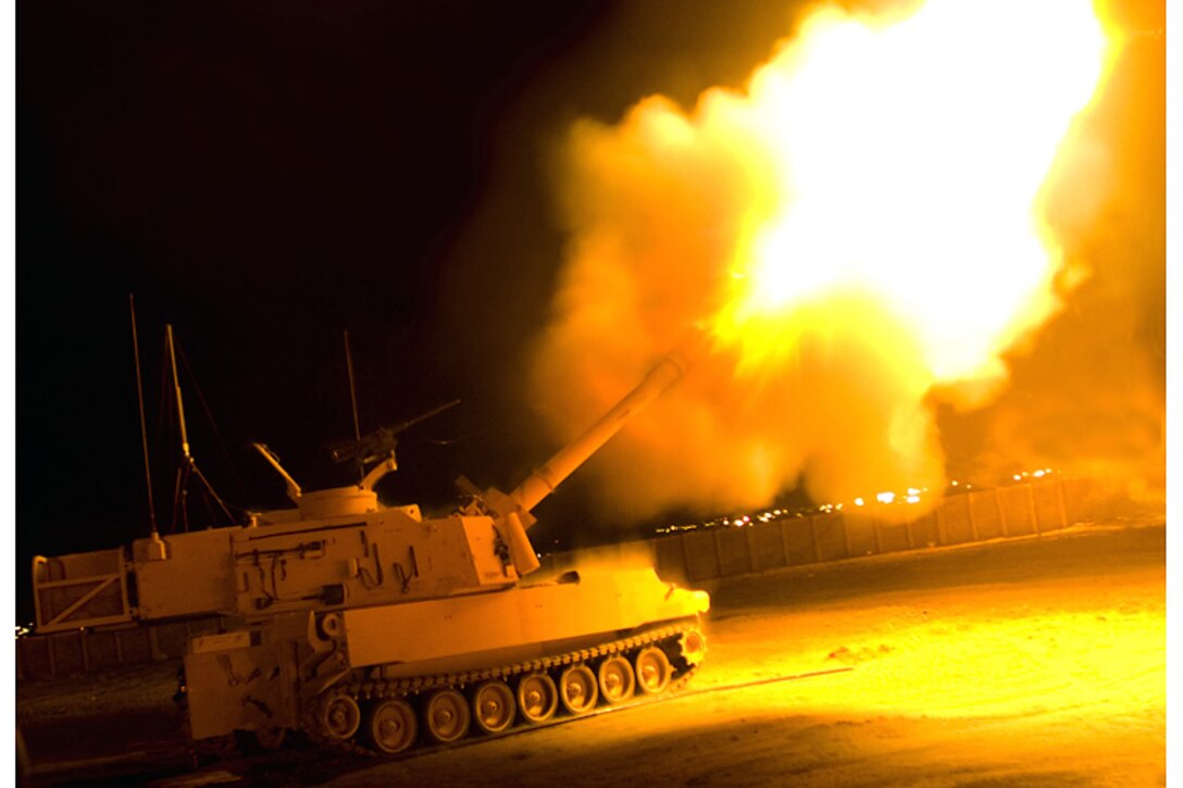 An M109 Paladin fires its 155 mm illumination rounds from Badoush Prison, outside Mosul, Iraq, in support of ground forces in Mosul March 29, 2008. The Paladin belongs to 3rd Armored Cavalry Regiment.
