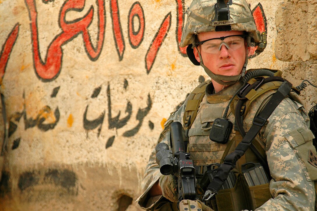 Army Sgt. Ian McPherson, an infantry soldier in 1st Platoon, Company D, 1st Battalion, 8th Infantry Regiment, 4th Infantry Division, scans his sector during a combat patrol in Mosul, Iraq, April 12, 2008.