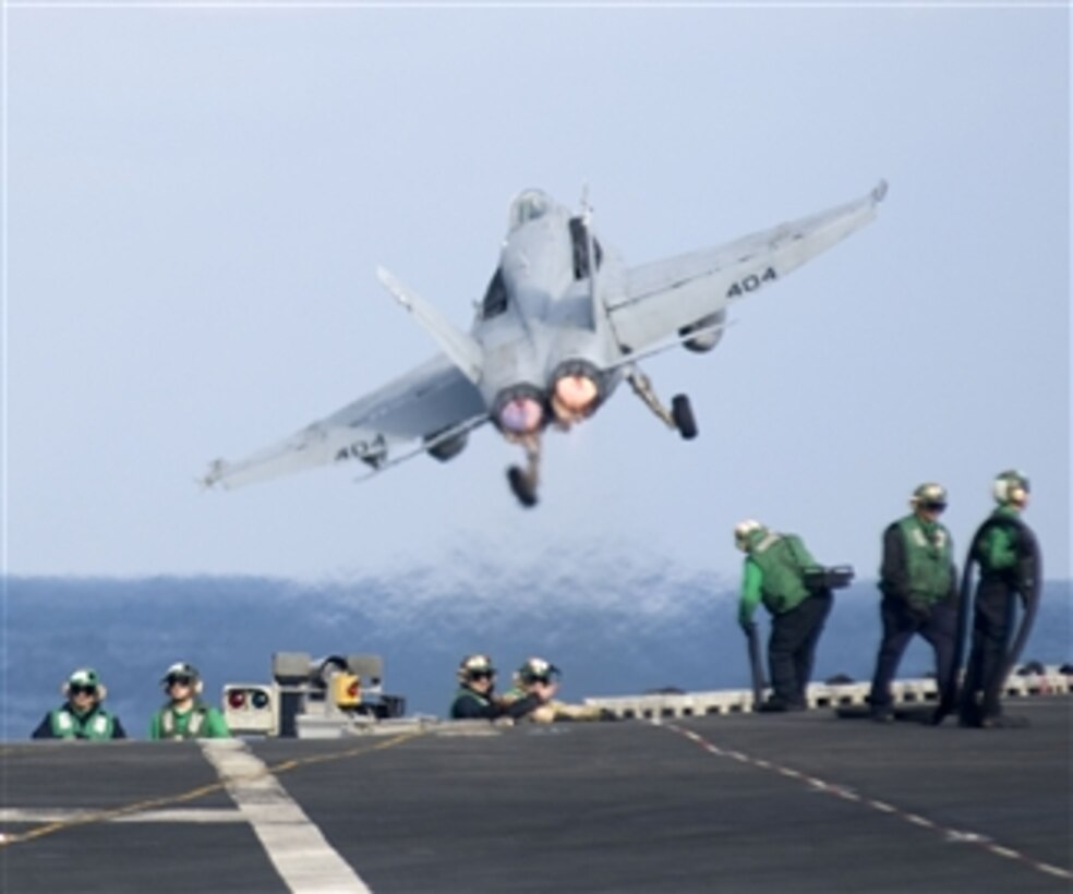 A U.S. Navy F/A-18C Hornet assigned to Strike Fighter squadron 25 launches from the flight deck of the aircraft carrier USS Carl Vinson (CVN 70) in the Pacific Ocean on Jan. 8, 2011.  The Carl Vinson and Carrier Air Wing 17 went on deployment to the U.S. 7th Fleet areas of responsibility.  