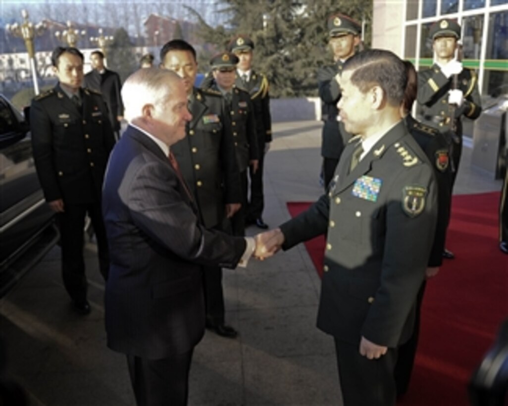 Secretary of Defense Robert M. Gates is greeted by Chinese Commander, 2nd Artillery Group Gen. Jing Zhiyuan at their facility in Qinghe, China, on Jan. 12, 2011.  Gates wrapped up a 4-day trip to China by visiting the People's Liberation Army 2nd Artillery Group and the Great Wall.  