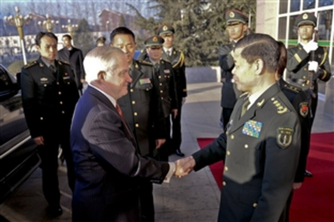 Chinese Gen. Jing Zhiyuan, commander, 2nd Artillery Corps, greets U.S. Defense Secretary Robert M. Gates at the artillery facility in Qinghe, China, Jan. 12, 2011. Gates wrapped up a four-day trip to China by visiting the People's Liberation Army 2nd Artillery Group and the Great Wall.