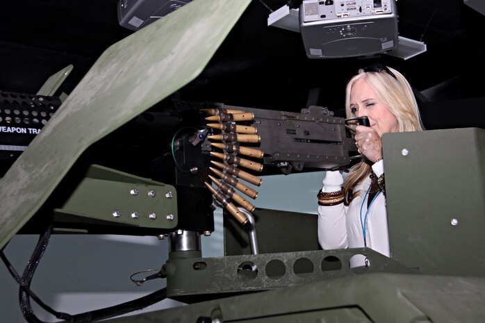 Susan Day, president, Combined Health Agencies, takes aim with a simulated .50 caliber machine gun on the Convoy Simulator during LEAD San Diego’s visit to Camp Pendleton, Jan. 12. The tour was designed to give a mutual understanding of both LEAD and MCI-West. The visit began at the base’s South Mesa Club where Maj. Gen. Anthony L. Jackson, Commanding General MCI-West, and Deputy Commander Colonel Michael Naylor gave briefs about the base’s community.